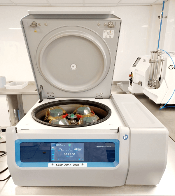 Thermo Scientific centrifuge with open lid showing the rotor and sample tubes, designed for high-speed sample separation.