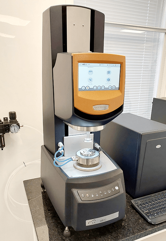 TA Instruments Discovery Hybrid Rheometer HR20, used for testing material viscosity and flow properties in food and pharmaceutical applications, with a touchscreen interface for easy control.
