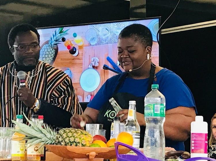lady making african inspired pineapple rum at foodfest