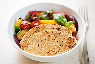 Meat-free, chicken-flavored mycoprotein fillets with grilled vegetables.